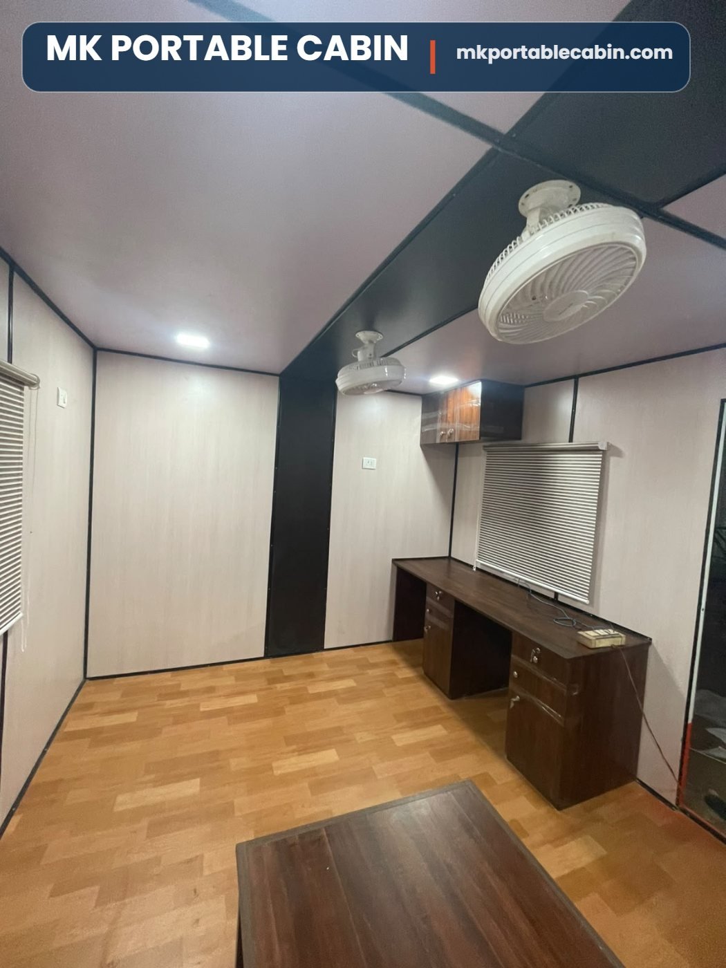 Three workstations inside 20 x 10 portable office cabin with wooden tables